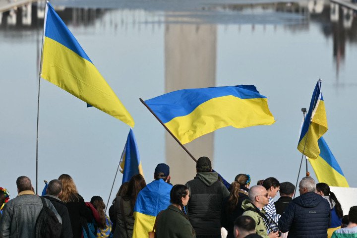 Activists take part in a rally to mark the fourth anniversary of Russia's war on Ukraine, at the Lincoln Memorial in Washington (Photo by Mandel NGAN / AFP via Getty Images)