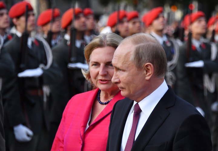 Russian leader Vladimir Putin and Austrian Foreign Minister Karin Kneissl attend a wreath-laying ceremony at the Soviet World War II memorial in Vienna, Austria, on June 5, 2018. (Source: Getty Images)
