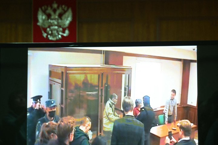 A screen set up at a hall of the Moscow City Court broadcasts the verdict announcement in the trial of US citizen Stephen Hubbard, 72, accused of fighting as a mercenary for Ukraine, in Moscow on October 7, 2024. (Source: Getty Images) A screen set up at a hall of the Moscow City Court broadcasts the verdict announcement in the trial of US citizen Stephen Hubbard, 72, accused of fighting as a mercenary for Ukraine, in Moscow on October 7, 2024. (Source: Getty Images)