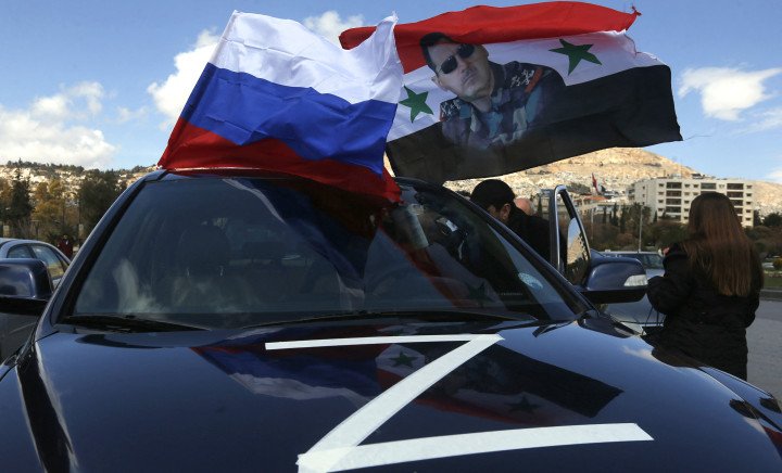 Syrians wave flag of Russia and a portrait of President Bashar al-Assad during a rally in support of Russia in the Syrian capital Damascus, on March 25, 2022. (Source: Louai Beshara) Syrians wave flag of Russia and a portrait of President Bashar al-Assad during a rally in support of Russia in the Syrian capital Damascus, on March 25, 2022. (Source: Louai Beshara)