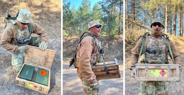 Ukrainian soldier uses the “Gyurza-1” exoskeleton to carry a heavy wooden ammunition crate during testing in field conditions. (Source: Defense Express)