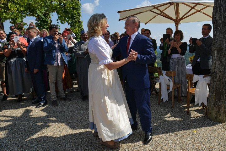 Austrian Foreign Minister Karin Kneissl dances with Russian leader Vladimir Putin during her wedding in Gamlitz, Austria, on August 18, 2018. (Source: Getty Images)