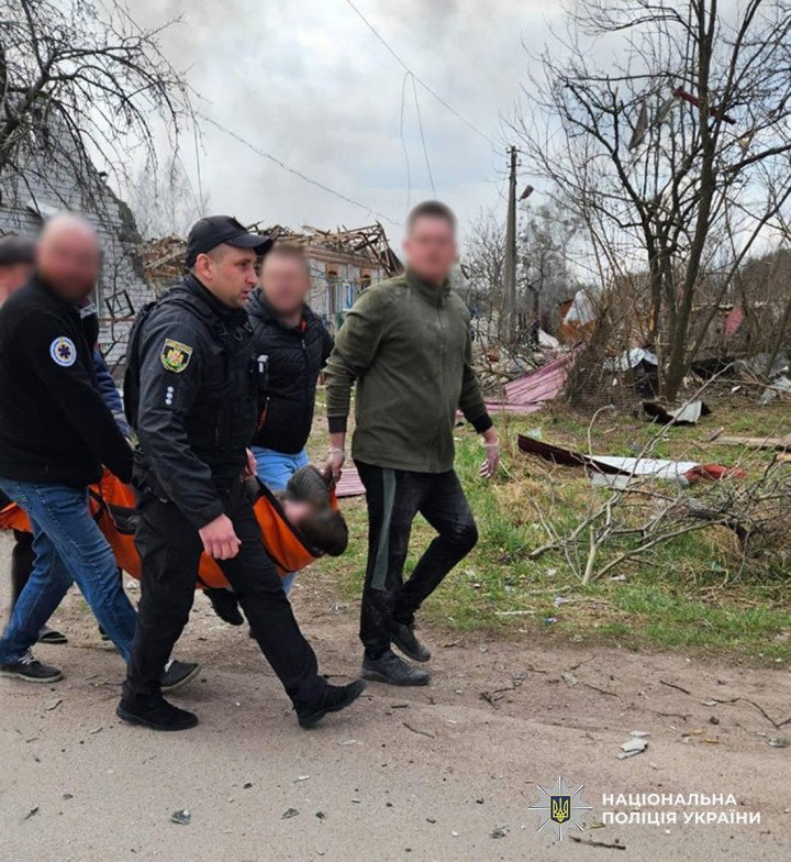 Rescue workers carrying an injured person from the debris following a recent attack in the region. (Source: National Police of Ukraine)