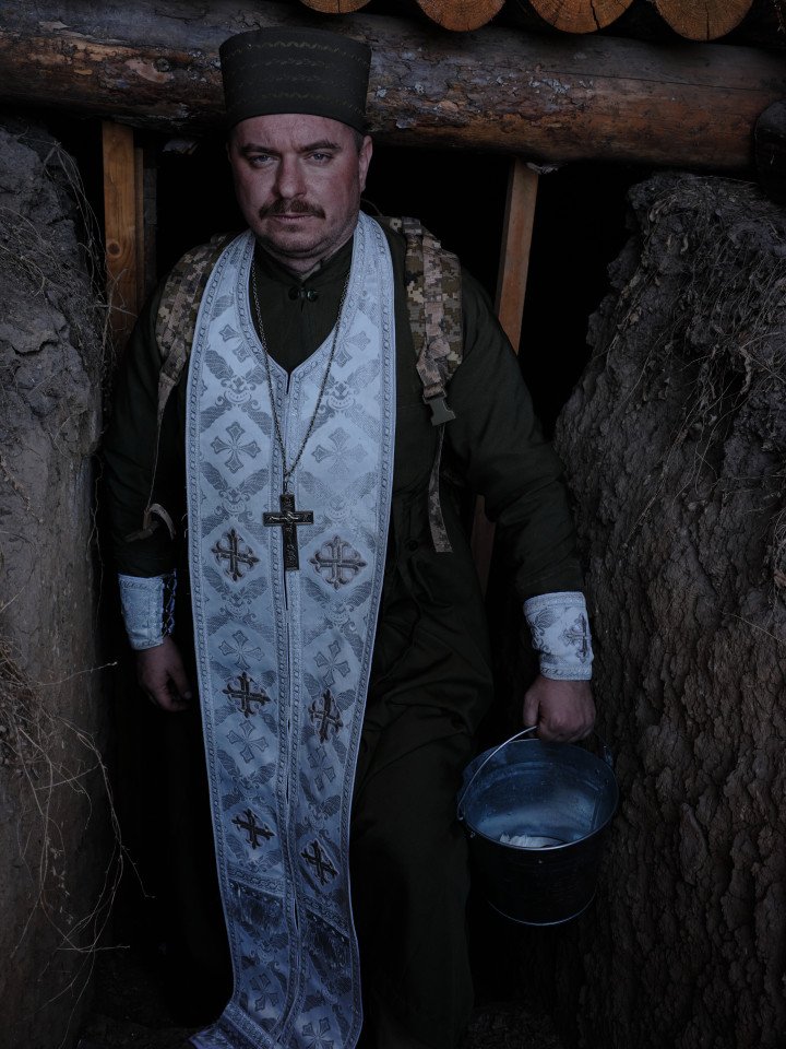 Father Mykola at the soldiers. Photo: Joshua Olley Father Mykola at the soldiers. Photo: Joshua Olley