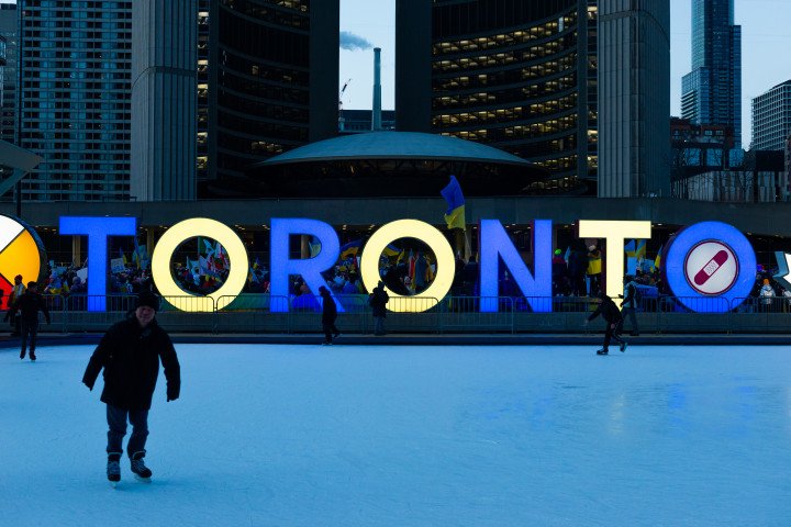 Toronto sign colored in Ukraininan flag colors in Downtown Nathan Phillips Square during a demonstration against the start of the war of Russian aggressors against Ukraine. (Photo by Anatoliy Cherkasov/NurPhoto via Getty Images)