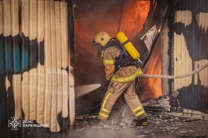 A firefighter battles flames at an industrial site in Kharkiv following a Russian airstrike on July 12. (Source: SES of Kharkiv Region) A firefighter battles flames at an industrial site in Kharkiv following a Russian airstrike on July 12. (Source: SES of Kharkiv Region)