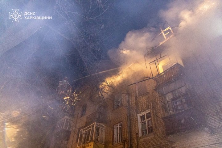 A residential building on fire during the night. Flames and smoke billow from the top floors as emergency crews respond. (Photo: Kharkiv Emergency Service)