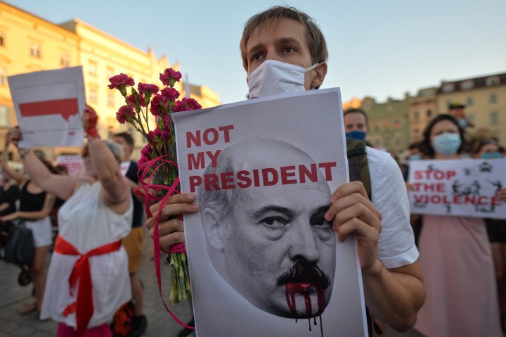 A protestor holds an image of Alexander Lukashenko, with an inscription 'Not My President' 2020. (Source: Artur Widak via Getty Images) A protestor holds an image of Alexander Lukashenko, with an inscription 'Not My President' 2020. (Source: Artur Widak via Getty Images)