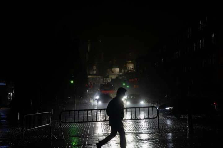 A man walks along a darkened street during blackout hours in Kyiv on November 20, 2025, after Russian missile and drone attacks on Ukrainian energy infrastructure amid the Russian invasion of Ukraine. (Source: Getty Images) A man walks along a darkened street during blackout hours in Kyiv on November 20, 2025, after Russian missile and drone attacks on Ukrainian energy infrastructure amid the Russian invasion of Ukraine. (Source: Getty Images)