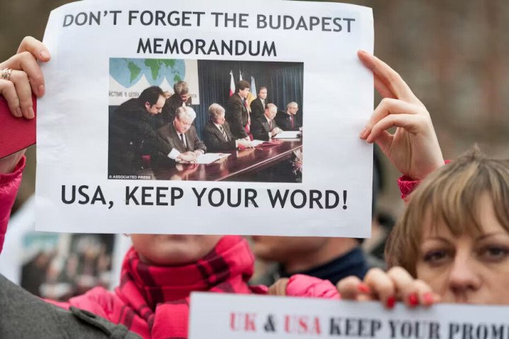 Protestors holding sign “memorandum USA, keep your word!” (Source: X) Protestors holding sign “memorandum USA, keep your word!” (Source: X)