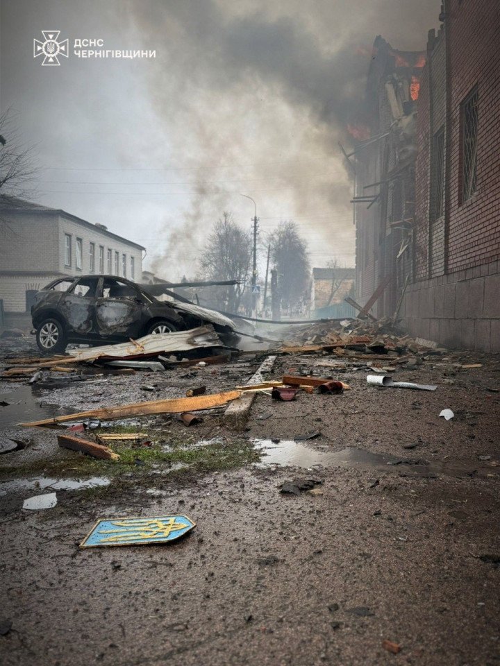 Debris and a burned-out vehicle lie in the street after a Russian attack on central areas of a Chernihiv region city. (Source: State Emergency Service of Ukraine)