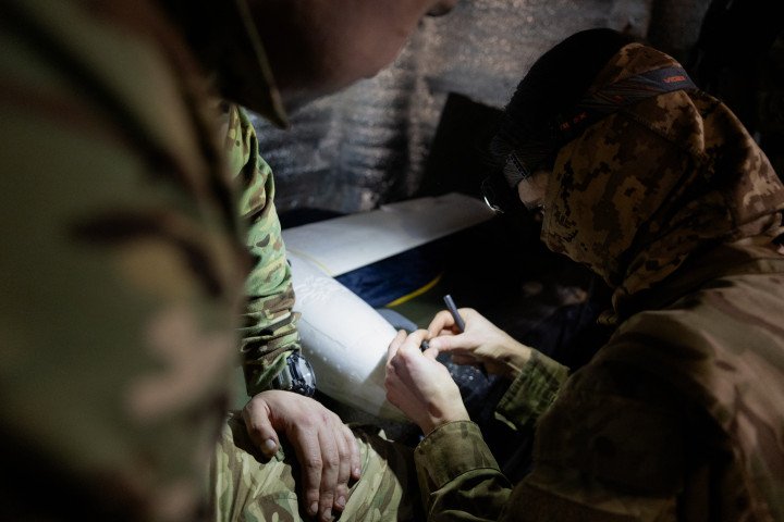 A Ukrainian serviceman of the 18th Sloviansk Brigade of the National Guard of Ukraine works to fix a drone interceptor. (Photo by Tetiana Dzhafarova via Getty Images) Ukrainian serviceman works to fix a drone interceptor