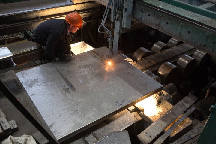 A worker guides a hot-rolled plate of titanium alloy through a cutting torch at the VSMPO-AVISMA Corp. plant in Verkhnyaya Salda, Russia (Source: Andrey Rudakov via Getty Images) A worker guides a hot-rolled plate of titanium alloy through a cutting torch at the VSMPO-AVISMA Corp. plant in Verkhnyaya Salda, Russia (Source: Andrey Rudakov via Getty Images)
