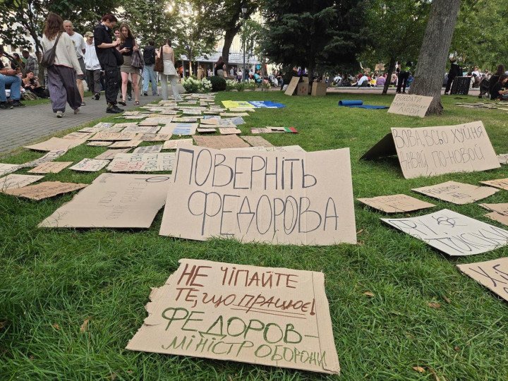 Cardboard protest signs placed on the grass demanding the reinstatement of Mykhailo Fedorov as Minister of Defense, July 24, 2026. (Source: Social media) Cardboard protest signs placed on the grass demanding the reinstatement of Mykhailo Fedorov as Minister of Defense, July 24, 2026. (Source: Social media)