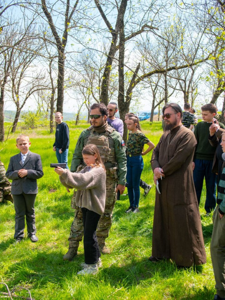 Children at the Voznesenie Esports school in Krasnodar, Russia are instructed on how to fire a handgun. Children at the Voznesenie Esports school in Krasnodar, Russia are instructed on how to fire a handgun.