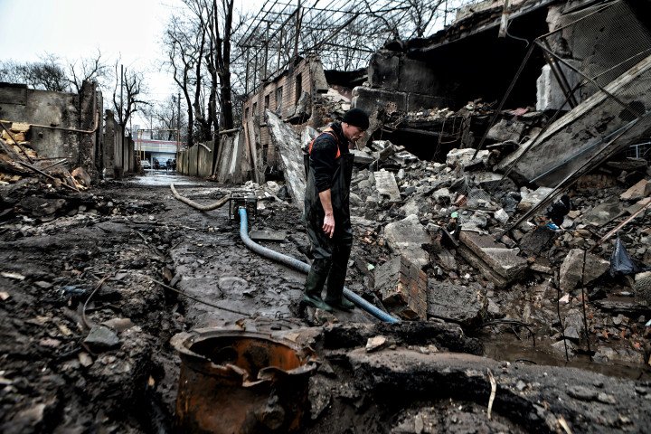 Utility workers clear up debris in a residential district hit by Russian attack on March 16, 2024 in Odesa, Ukraine. (Photo by Yan Dobronosov/Global Images Ukraine via Getty Images)