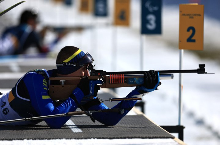 Taras Rad of Ukraine competes at the shooting range during the men’s sitting sprint in para biathlon on the opening day of the Milano Cortina 2026 Winter Paralympic Games in Val di Fiemme, Italy, on March 7, 2026, where he won Ukraine’s first gold medal of the Games. (Source: Getty Images)