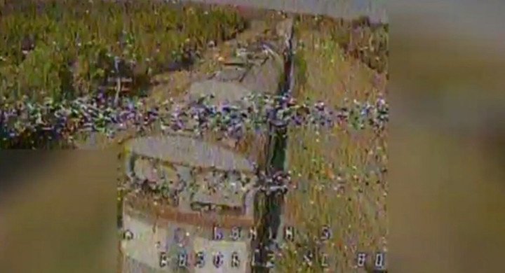 Russian 2TE116 diesel locomotive pulling a fuel train seen through the targeting view of a Ukrainian FPV drone, June 2024. (Source: Defense Express)