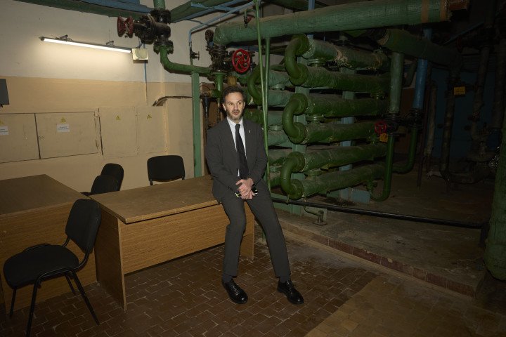 Heorhii in an underground room where international negotiations and press conferences were being held due to Russian shelling. Photo: Joshua Olley/UNITED24 Media.