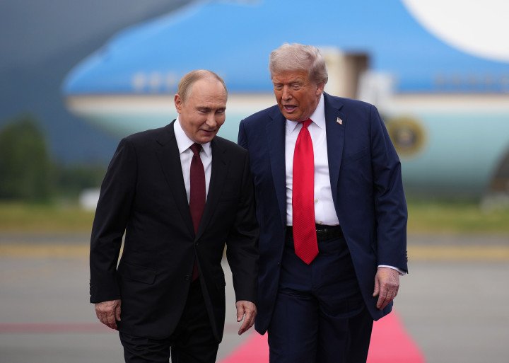 U.S. President Donald Trump walks with Russian leader Vladimir Putin as they arrives at Joint Base Elmendorf-Richardson on August 15, 2025 in Anchorage, Alaska. Photo: Andrew Harnik/Getty Images