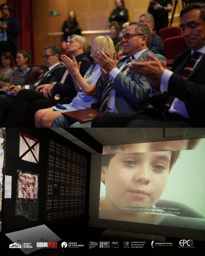 Los invitados que asistieron al evento inaugural aplauden, mientras cerca se proyecta una película sobre niños afectados por la guerra. (Fuente: Bring Kids Back UA)