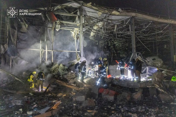 Ukrainian rescuers search through the rubble of a heavily damaged facility in the Kharkiv region following a Russian overnight attack on January 13, 2026. (Photo: State Emergency Service)