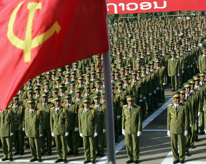 Lao soldiers stand at attention as they listen to the speech of Laos' People's Revolutionary Party Chairman Khamtay Siphandone during the official celebrations, 02 December 2005 in Vientiane to mark the 30th anniversary of the communist regim in landlocked Laos, one of Asia's poorest countries. (Photo by HOANG DINH NAM/AFP via Getty Images) Lao soldiers stand at attention as they listen to the speech of Laos' People's Revolutionary Party Chairman Khamtay Siphandone during the official celebrations, 02 December 2005 in Vientiane to mark the 30th anniversary of the communist regim in landlocked Laos, one of Asia's poorest countries. (Photo by HOANG DINH NAM/AFP via Getty Images)