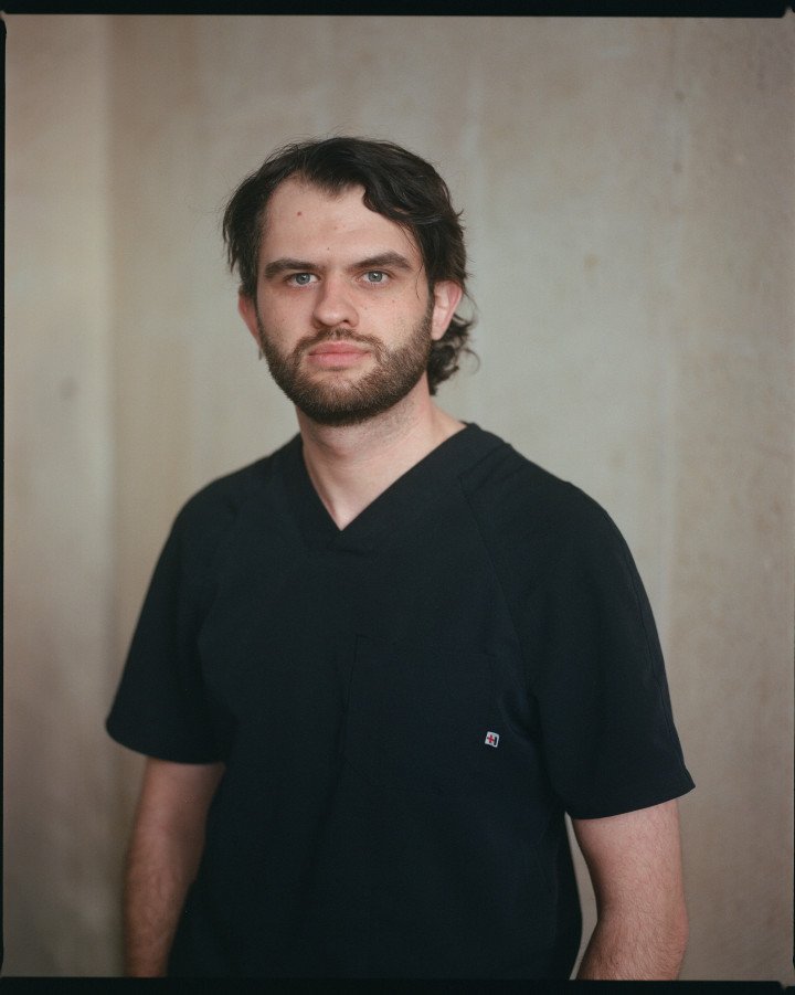 Dr. Kyrylo Chugai, co-organizer of the mission and ophthalmologist from Chernihiv, helps manage patient intake, logistics, and coordination between Ukrainian and American surgical teams. Photo: Josh Olley Dr. Kyrylo Chugai, co-organizer of the mission and ophthalmologist from Chernihiv, helps manage patient intake, logistics, and coordination between Ukrainian and American surgical teams. Photo: Josh Olley
