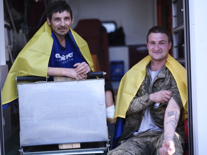 Two injured Ukrainian soldiers, recently released from Russian captivity, sit inside a medical vehicle. (Source: Zelenskyy/Telegram) Two injured Ukrainian soldiers, recently released from Russian captivity, sit inside a medical vehicle. (Source: Zelenskyy/Telegram)