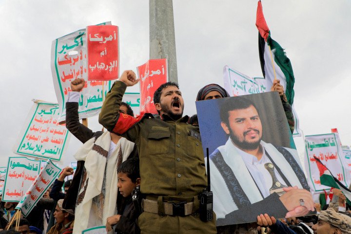 A protester with a portrait of Houthi leader Abdul-Malik al-Huthi during a rally in the Houthi-controlled capital Sanaa on January 19, 2024. (Source: Mohammed Huais via Getty Images) A protester with a portrait of Houthi leader Abdul-Malik al-Huthi during a rally in the Houthi-controlled capital Sanaa on January 19, 2024. (Source: Mohammed Huais via Getty Images)