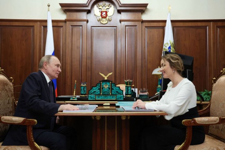 Russia's President Vladimir Putin meets with Russia's presidential commissioner for children's rights Maria Lvova-Belova. This image is distributed by Russian state owned agency Sputnik (Photo by ALEXANDER KAZAKOV/POOL/AFP via Getty Images) Russia's President Vladimir Putin meets with Russia's presidential commissioner for children's rights Maria Lvova-Belova. This image is distributed by Russian state owned agency Sputnik (Photo by ALEXANDER KAZAKOV/POOL/AFP via Getty Images)