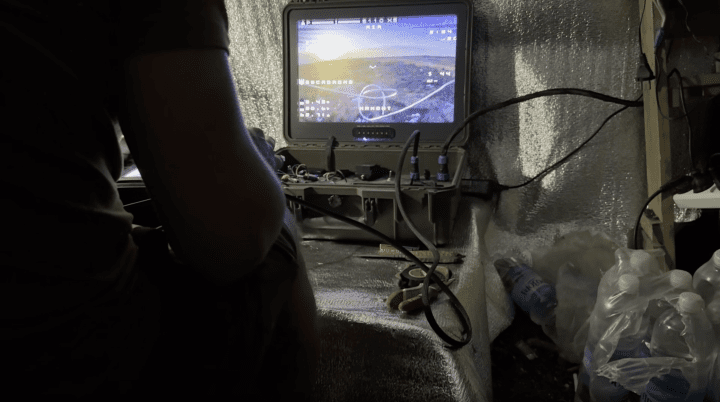 Skiba pilots a drone during a night assault, watching the strike unfold on-screen. (Source: UNITED24 Media) Skiba pilots a drone during a night assault, watching the strike unfold on-screen. (Source: UNITED24 Media)