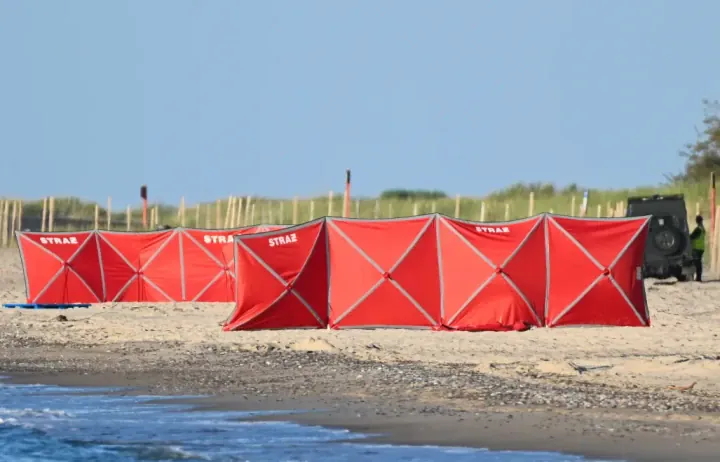 Polish emergency services secure the site where a Russian Gerbera 2 drone was recovered near Rusinowo on the Baltic coast.