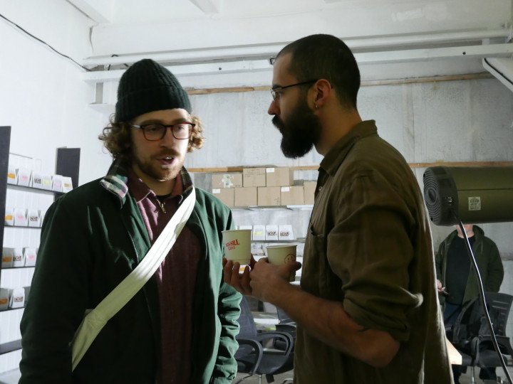 On grand opening day, High Hill Coffee owner Iliia Elisey Kastornykh is offering customers celabratory cups of champagne and samples of coffee. November 2025. Photo: Maryna Maryginal