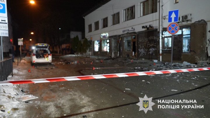 The blast site on Danylyshyna Street in Lviv is cordoned off with police tape as investigators examine debris near a storefront. (Source: National Police of Ukraine)