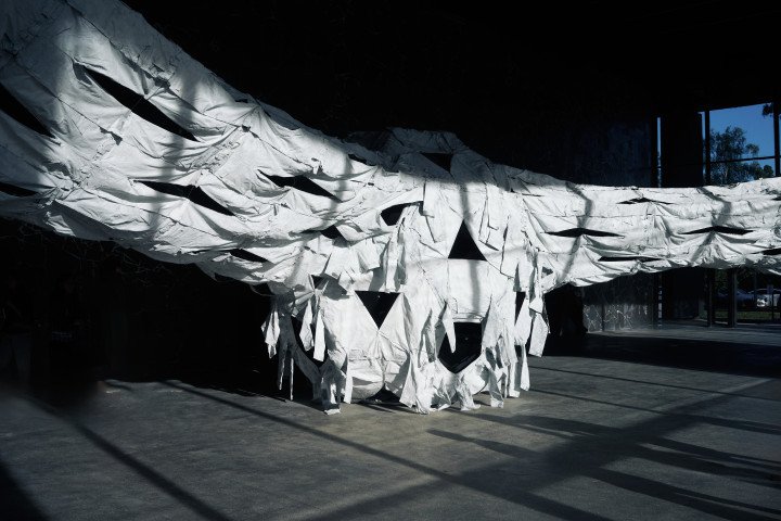 Installation view of Ai Weiwei’s Three Perfectly Proportioned Spheres and Camouflage Uniforms Painted White, September 14, at the Kyiv Pavilion of Culture. (Source: UNITED24 Media/Joshua Olley)