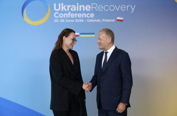 Polish Prime Minister Donald Tusk greets Ukrainian Prime Minister Yuliia Svyrydenko at the Ukraine Recovery Conference (URC 2026) in Gdańsk, Poland, on June 25, 2026. (Source: Getty Images)
