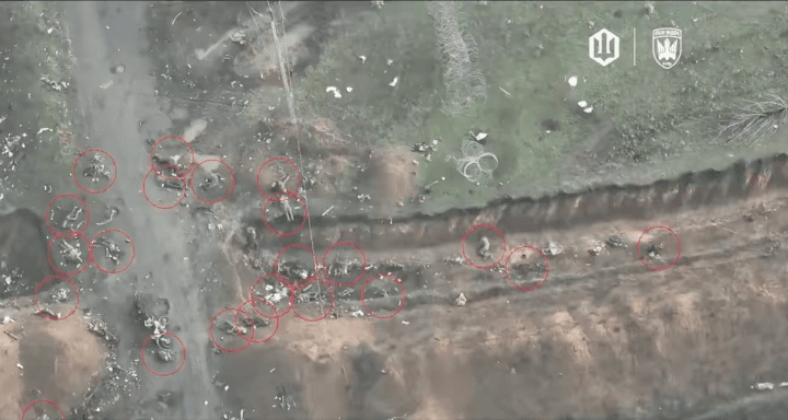 Russian infantry casualties strewn along a trench of fortification line and access road after successive failed assault—each red circle marking a body visible in Ukrainian drone footage. (Source: 414 Magyar’s Birds) Russian infantry casualties strewn along a trench of fortification line and access road after successive failed assault—each red circle marking a body visible in Ukrainian drone footage. (Source: 414 Magyar’s Birds)