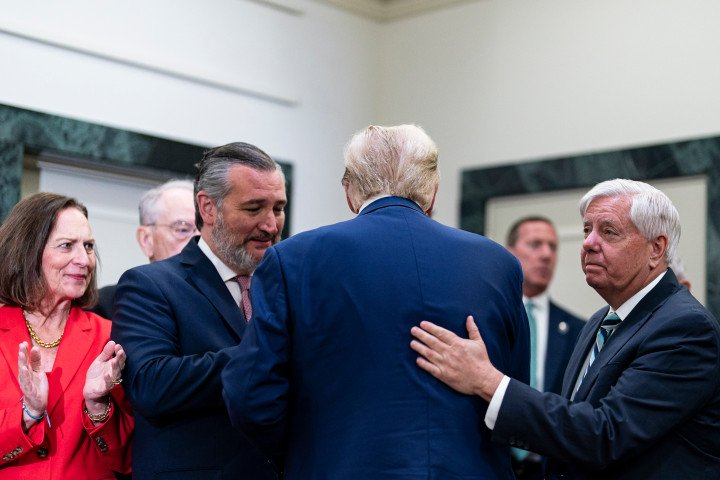 US President Donald Trump, center, is greeted by Senator Ted Cruz, a Republican from Texas, left, and Senator Lindsey Graham, a Republican from South Carolina, right, following a meeting with Senate Republicans at the National Republican Senatorial Committee (NRSC) office in Washington, DC, on Thursday, June 13, 2024. (Source: Getty Images) US President Donald Trump, center, is greeted by Senator Ted Cruz, a Republican from Texas, left, and Senator Lindsey Graham, a Republican from South Carolina, right, following a meeting with Senate Republicans at the National Republican Senatorial Committee (NRSC) office in Washington, DC, on Thursday, June 13, 2024. (Source: Getty Images)