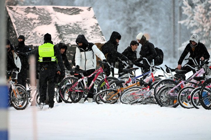 Migrants arrive with bicycles at the international border crossing at Salla, northern Finland, on November 23, 2023. (Source: Jussi Nukari via Getty Images) Migrants arrive with bicycles at the international border crossing at Salla, northern Finland, on November 23, 2023. (Source: Jussi Nukari via Getty Images)