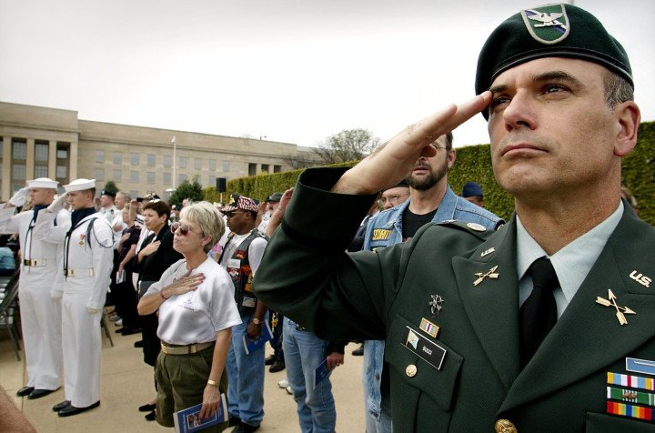 US Army Colonel Steve Bucci (R) salutes during the playing of the National Anthem at the POW/MIA Observance ceremony 20 September 2002 at the Pentagon in Washington, DC. This observance is one of six days throughout the year that Congress has mandated the flying of the National League of Families POW/MIA flag. (Photo: STEPHEN JAFFE/AFP via Getty) US Army Colonel Steve Bucci (R) salutes during the playing of the National Anthem at the POW/MIA Observance ceremony 20 September 2002 at the Pentagon in Washington, DC. This observance is one of six days throughout the year that Congress has mandated the flying of the National League of Families POW/MIA flag. (Photo: STEPHEN JAFFE/AFP via Getty)