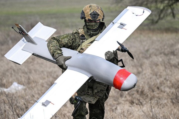 A Russian serviceman carries a Molniya-1 strike drone, one of the UAV models produced by Atlant-Aero in Taganrog.