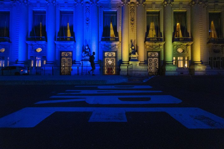The Palacio Piratini, seat of the Rio Grande do Sul state Government, is illuminated with the colours of the Ukrainian flag in solidarity, in Porto Alegre, Brazil, on March 2, 2022. (Photo by SILVIO AVILA/AFP via Getty Images)