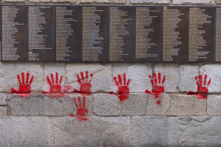 Red hands graffiti on the "Wall of the Righteous"  outside the Shoah memorial in Paris. (Photo by Antonin UTZ / AFP) (Photo by ANTONIN UTZ/AFP via Getty Images)