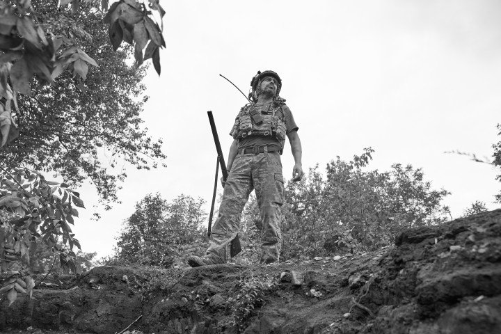 Member of the 28th Brigade with a 1952 double-barreled 20-gauge shotgun, searching for a drone. Photo: Josh Olley/UNITED24 Media
