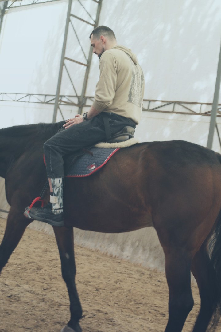 Rostyslav Prystupa rides around the dressage arena at the Bucha Stables in Mai 2025. (Photo: Lucile Brizard) Rostyslav Prystupa rides around the dressage arena at the Bucha Stables in Mai 2025. (Photo: Lucile Brizard)