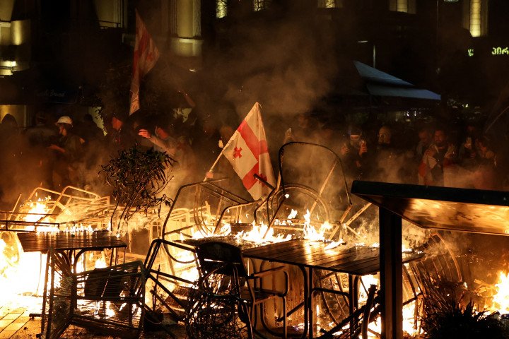Protesters burn barricades during clashes with police at an opposition rally in central Tbilisi on Georgia’s local election day, October 4, 2025. (Source: Getty Images)