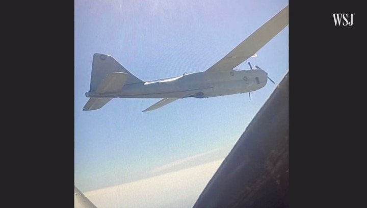 A Russian Orlan-10 reconnaissance drone captured midair from the cockpit of a pursuing Ukrainian Yak-52. (Source: The Wall Street Journal)