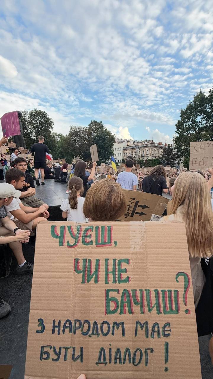 A protester holds a sign reading, “Do you hear us, or do you see us? There must be dialogue with the people,” during a rally in Ukraine. (Source: Serhii Sternenko) A protester holds a sign reading, “Do you hear us, or do you see us? There must be dialogue with the people,” during a rally in Ukraine. (Source: Serhii Sternenko)