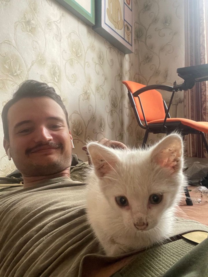 Edvard Selander with a cat in Ukraine. (Source: Selander family archive) 